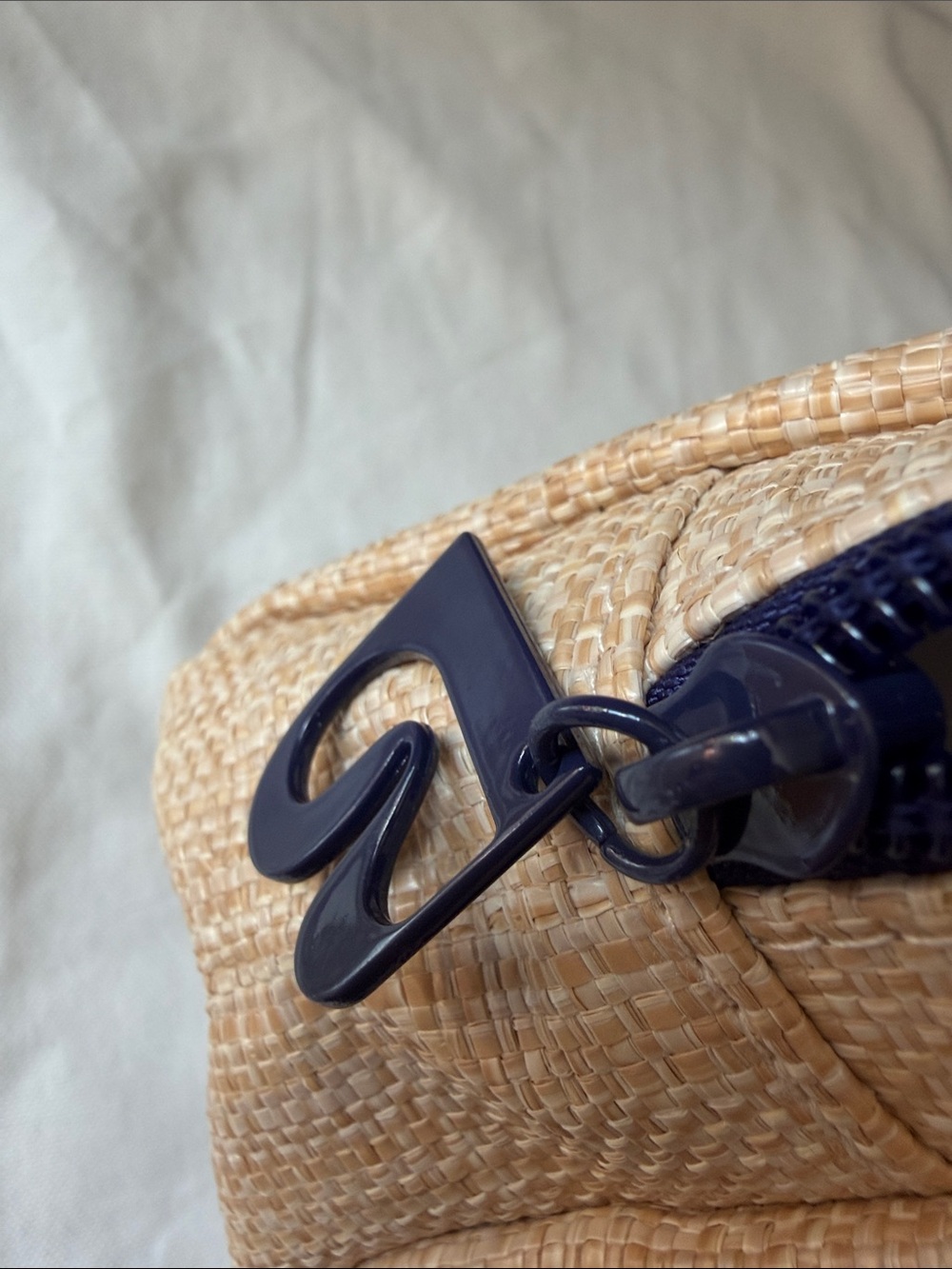 B natural Raffia cosmetic bag with blue hardware